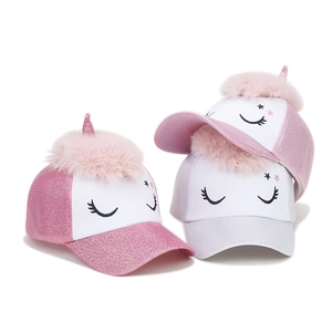 Sparkly unicorn baseball cap for kids featuring a pink pom-pom and glitter finish