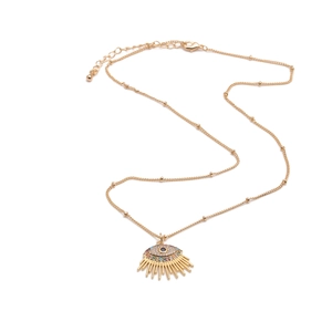 Detail view of gold-plated evil eye pendant necklace with colorful cubic zirconia stones