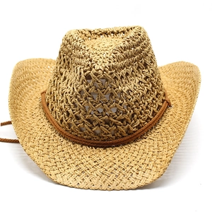 Detail of hollow-out straw western cowboy hat with breathable mesh and chin cord