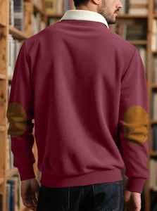 Detail of burgundy ribbed sweater with contrast elbow patches and white polo collar back view