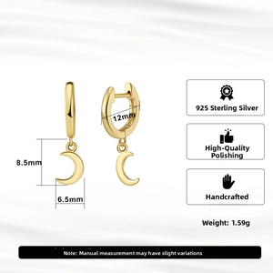 Detail view of 925 sterling silver moon earrings with high quality 18K gold polishing