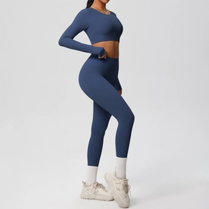 Deep blue seamless long-sleeve crop top and high-waisted leggings set for yoga