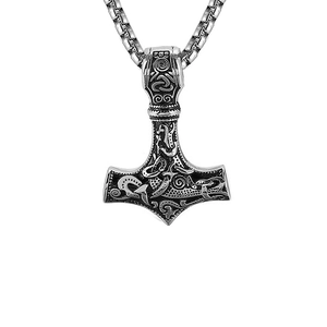 Detail of silver Thor's Hammer pendant with Viking engravings and box chain necklace