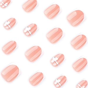 Short square press-on nails with white French tips and delicate floral patterns