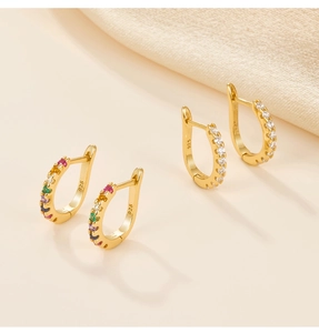 Close-up of S925 sterling silver earrings set with colorful and clear cubic zirconia stones