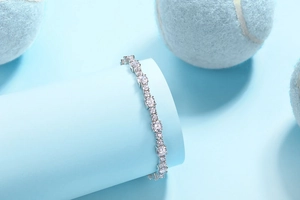 Detail of S925 sterling silver tennis bracelet featuring row of sparkling moissanite stones