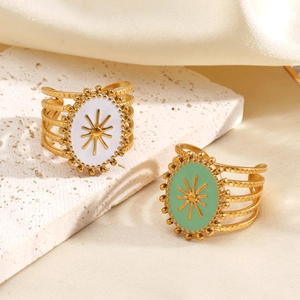 Vintage gold stainless steel rings with mint green and white enamel starburst patterns