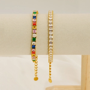 Detailed macro view of colorful square-cut zircon tennis bracelets on a display