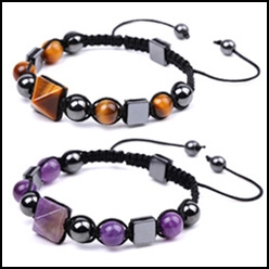 Detailed shot of amethyst and tiger eye stone beaded bracelets with woven cord