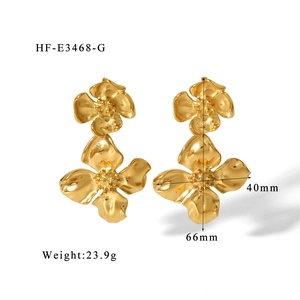 Detailed view of oversized 18K gold-plated floral earrings with size and weight dimensions