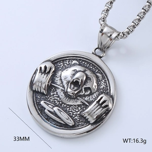 Macro shot of a vintage silver roaring bear head pendant with 33mm diameter details