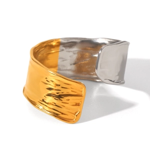 Minimalist wide open ring with hammered gold and silver two-tone metallic texture