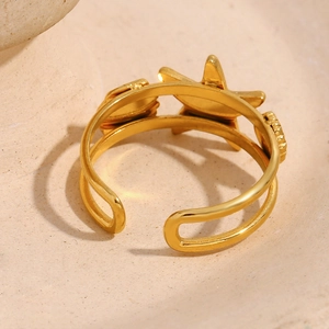 Adjustable 18K gold plated stainless steel starfish and heart ring on stone surface