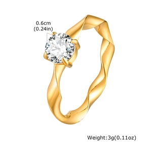 Detail view of gold Mobius ring with 0.6cm zircon setting and weight specifications