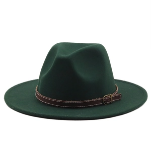 Detailed view of dark green wool fedora with brown leather strap and metal buckle