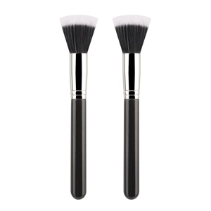 Close-up of dual professional duo-fiber stippling brushes with flat fan-shaped bristles