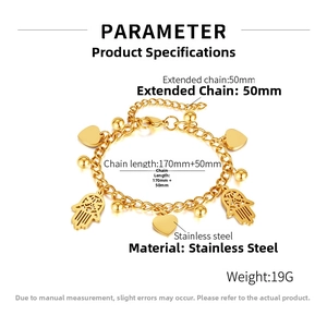 Detail of gold stainless steel bracelet with Hamsa Hand and heart charms and length specs