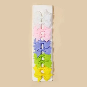 Set of 10 ribbed ribbon bow hair clips in pastel colors on white display cards