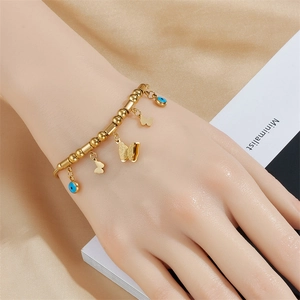 Minimalist gold butterfly bracelet with blue evil eye beads for women fashion