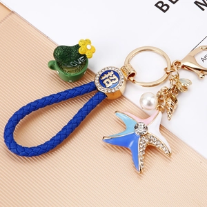 Blue nautical keychain with braided leather strap, starfish, pearl and shell charms