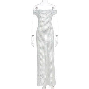Detailed front view of white off-shoulder polka dot maxi dress on a mannequin