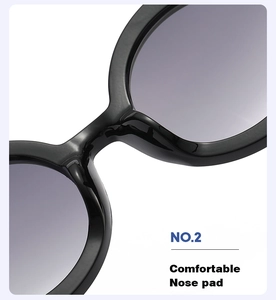 Detail of integrated comfortable nose pads on stylish black round frame sunglasses