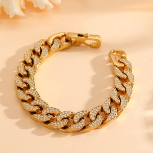 Gold Cuban link bracelet with iced-out pave diamonds shown in a circular display