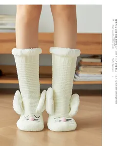Detail of plush fleece socks featuring cute rabbit ears and premium knit texture