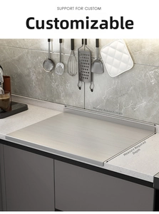 Close-up of brushed stainless steel kitchen countertop board with custom size marking