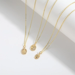 Elegant gold necklaces with portrait pendants and sparkling zircons on white background