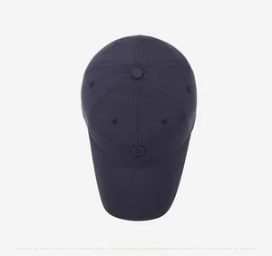Top down view of a navy blue fleece baseball cap with a subtle shield logo detail