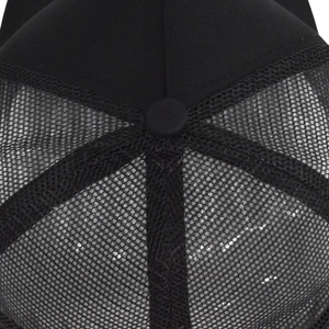 Detail of premium mesh fabric and reinforced stitching on a black trucker baseball cap