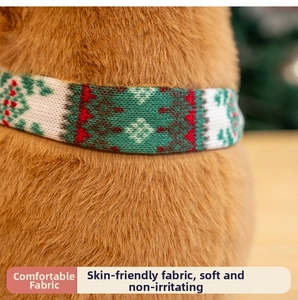 Detailed close-up of Capybara plush fur texture with festive red and green knitted scarf