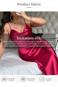 Macro detail of wine red imitation silk slip dress showing the satin weave texture