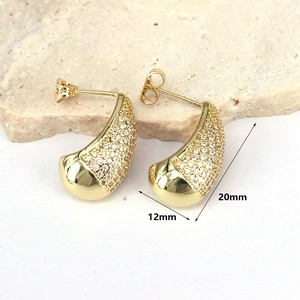 Detailed view of gold geometric teardrop earrings with crystals and size markings