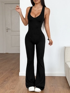 Chic black halter neck sleeveless jumpsuit with V-neck and flared leg silhouette