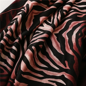 Macro shot of zebra pattern fabric texture and soft drapes on a summer beach shawl