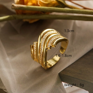 Detail of gold layered open ring with sparkling pavé zircons and dimension markings