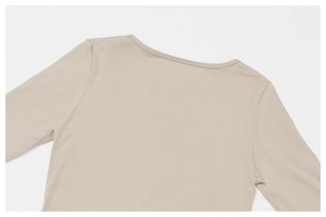 Detail of the high-elasticity beige round neck yoga top with seamless stitching and soft fabric