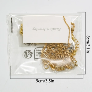 Measurement photo of layered gold chain bracelets set in packaging, 9cm by 8cm size detail