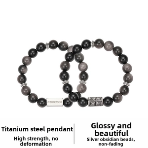 Detailed macro view of obsidian beaded bracelet featuring titanium steel Forever engraved tag