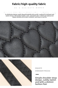 Detailed view of black heart-quilted leather fabric with durable waterproof texture