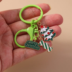 Detail of Christmas tree keychain with candy charm and gold Merry Christmas tag
