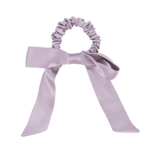 Light purple mulberry silk scrunchie with a large bow showing elegant satin luster