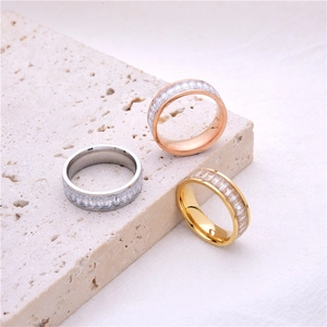 Three titanium steel rings in rose gold, silver, and gold with baguette-cut cubic zirconia