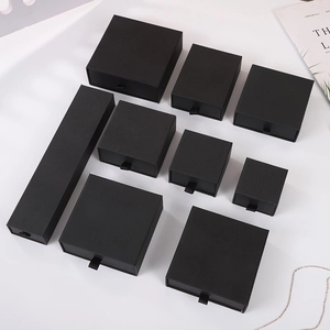 Minimalist black drawer jewelry box collection with silk pull tabs in various sizes