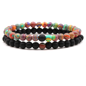Detail view of 6mm distance bracelets with textured colorful beads and matte black stones