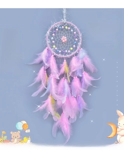 Close-up of a pink dreamcatcher with decorative beads and soft pastel gradient feathers