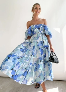 Detail of blue floral off-shoulder dress with tiered ruffle skirt and puff sleeves