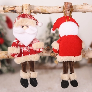 Hanging Santa Claus plush ornaments on wooden branches for festive Christmas tree decor